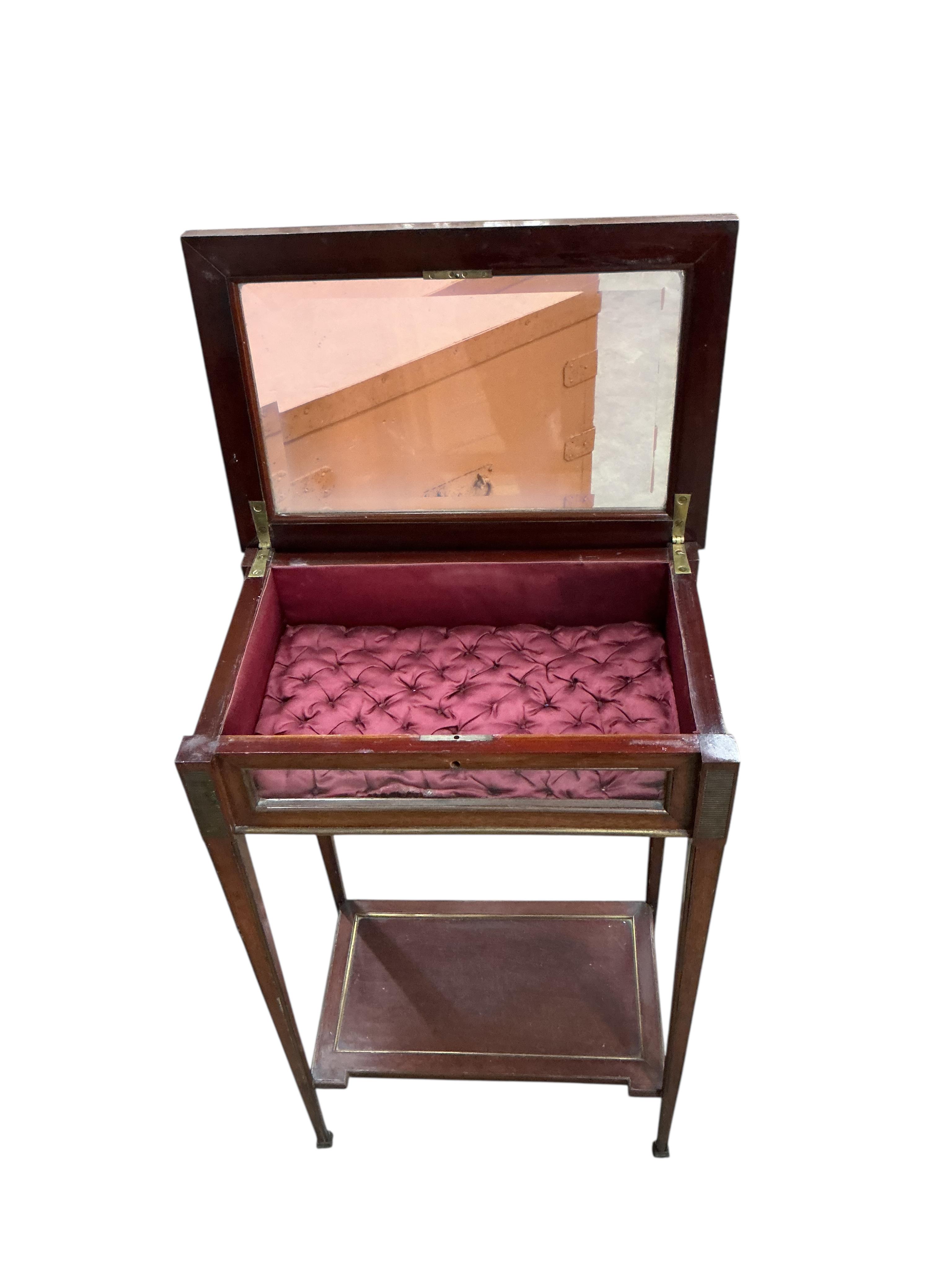 An early 20th century French brass mounted mahogany bijouterie table, label affixed inside reading: 26 Rue de Charonne, Passage de L'Homme. E. Mougin, width 43cm, depth 28cm, height 70cm
